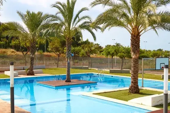 A pool surrounded by trees, representing the seasonal engineering work being optimized
