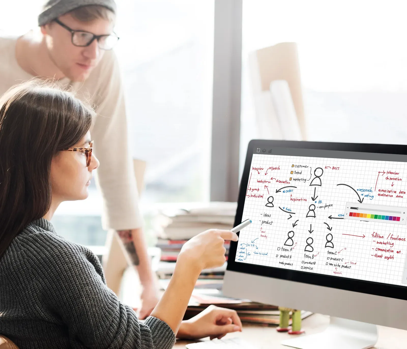 A modeling specialist building a process simulation on screen