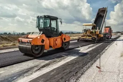 An automated road-paving operation laying a new road surface