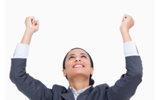 Business women excited with arms up in celebration